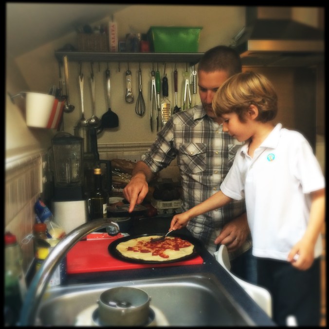 Felix making pizza